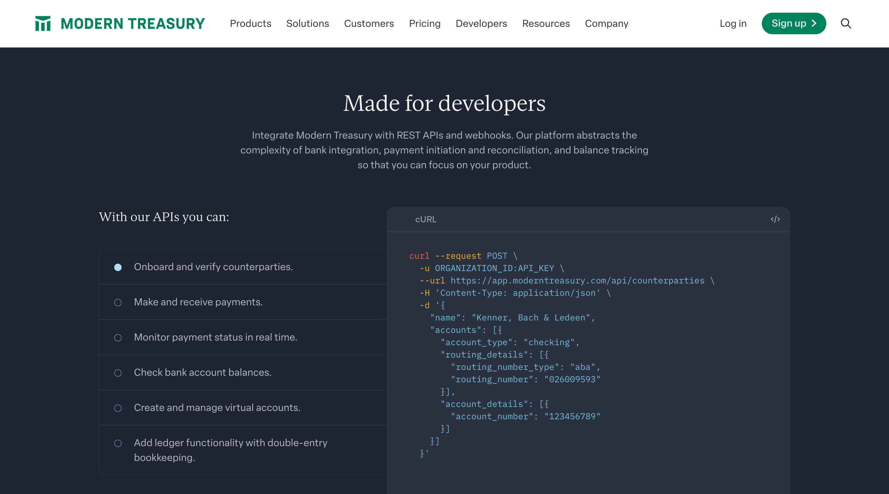 Screenshot of the 'Made for developers' section of the Modern Treasury home page. After an introduction paragraph the section lists the features of the Modern Treasury API on the left of the screen. On the right is an example cURL command which can be used to make an API request.