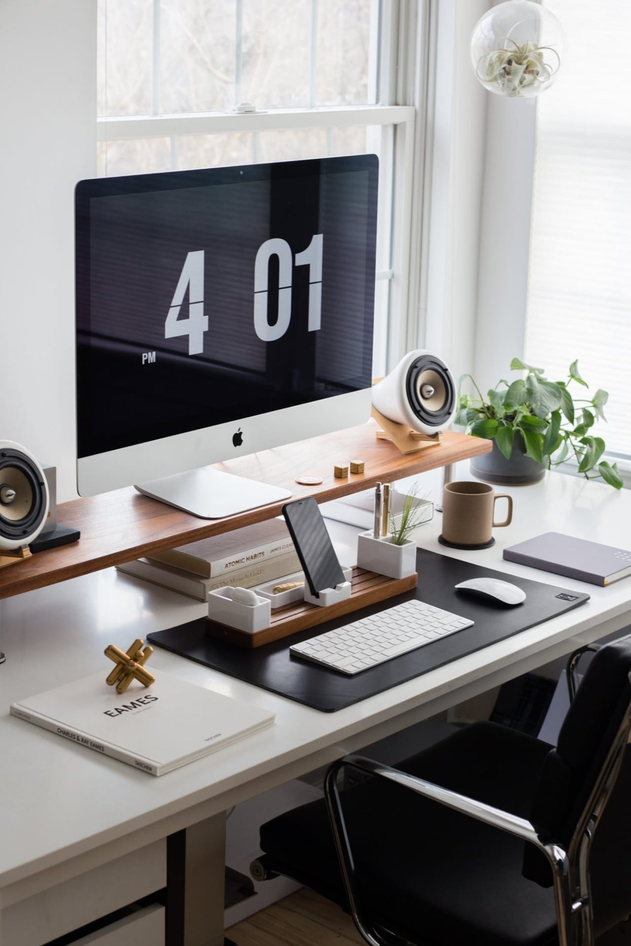 Extra large black leather workspace pad on desk with computer, wooden shelf, desk organizer, and computer peripherals.