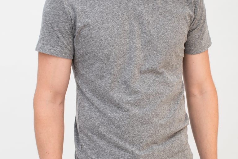 Model wearing plain gray basic tee.